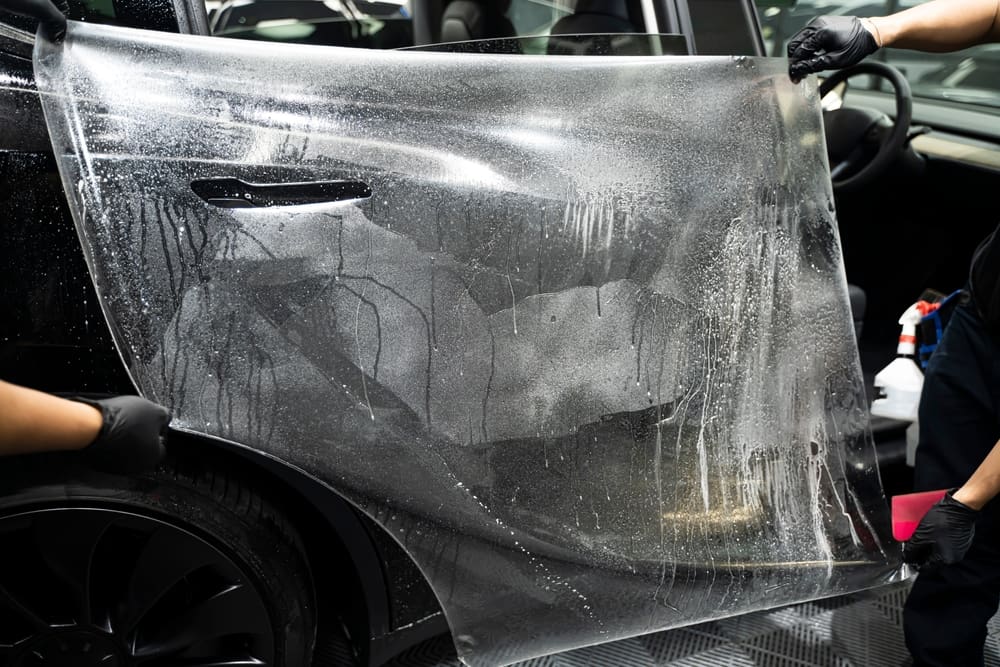 Worker,Hands,Installation,On,Luxury,Car.,Pu,Premium,Ppf,Film.